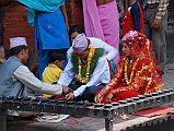Kathmandu Patan 04 Kumbeshwar Temple 02 Hindu Wedding Ceremony I was lucky enough to see part of a Hindu wedding ceremony at the Kumbeshwar Temple in Patan. The groom wore a traditional garland of grass around his neck.
